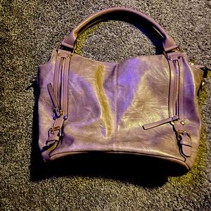 Solid stiff bottom. No tears or stains. Clean inside & out. Center zipper pocket